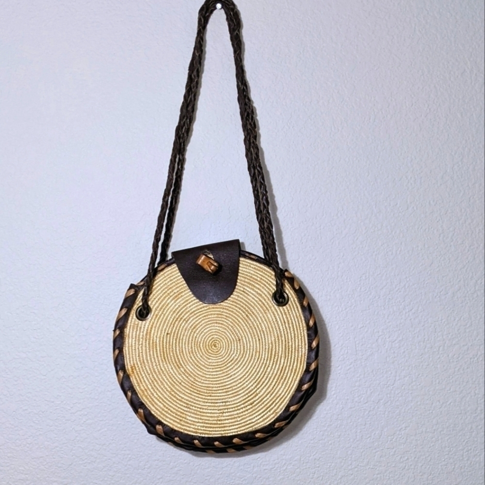Handwoven Round Straw Crossbody with a Dark Leather Strap and Flap